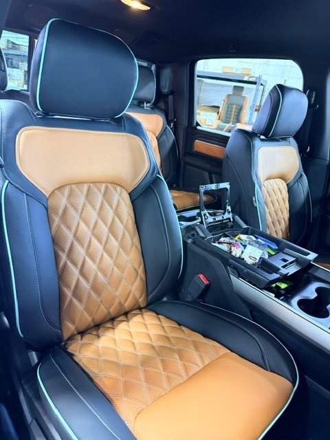 Ram front seats in black leather with saddle diamond inserts and Tiffany blue piping