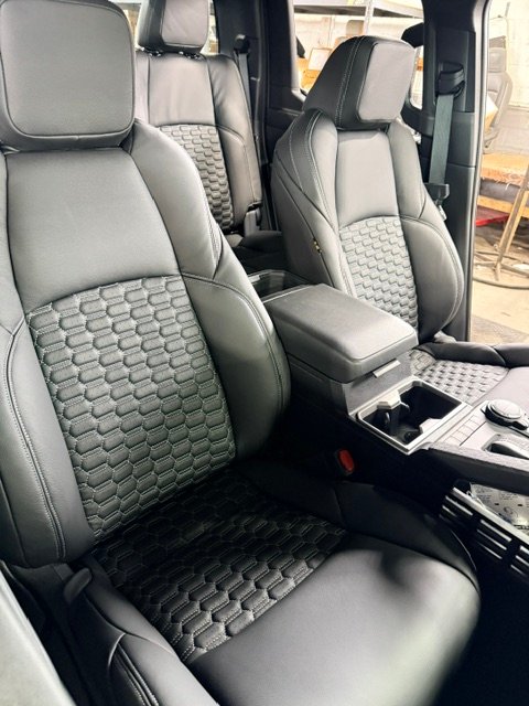 Toyota Tacoma front seats in black leather with honeycomb-stitched inserts