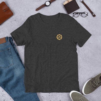The tee laid flat with jeans and accessories